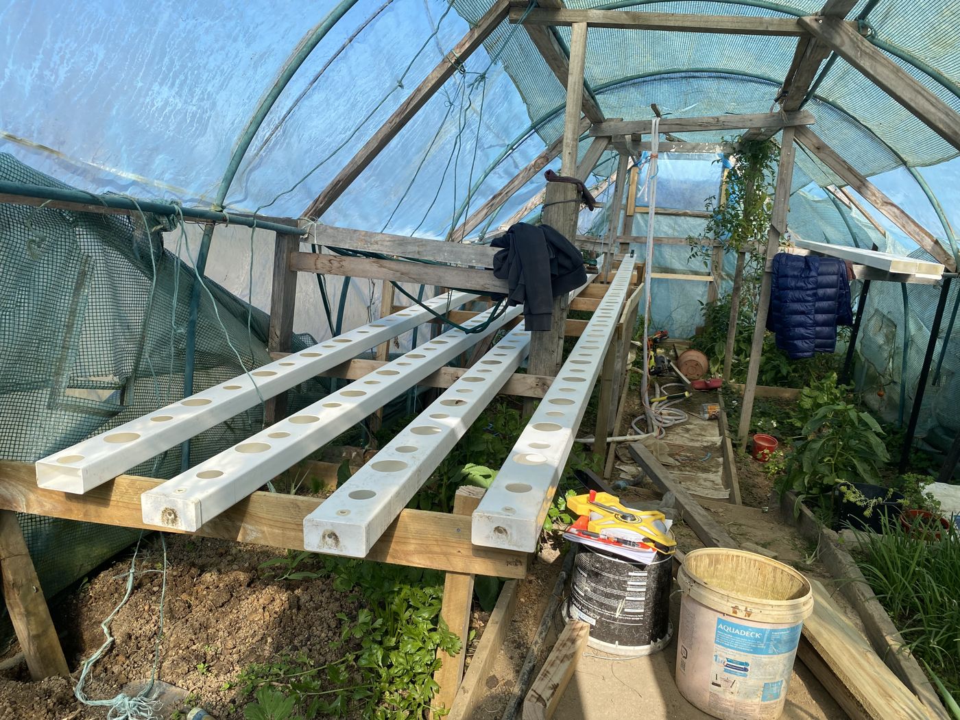 Empty NFT channels mounted on timber frame